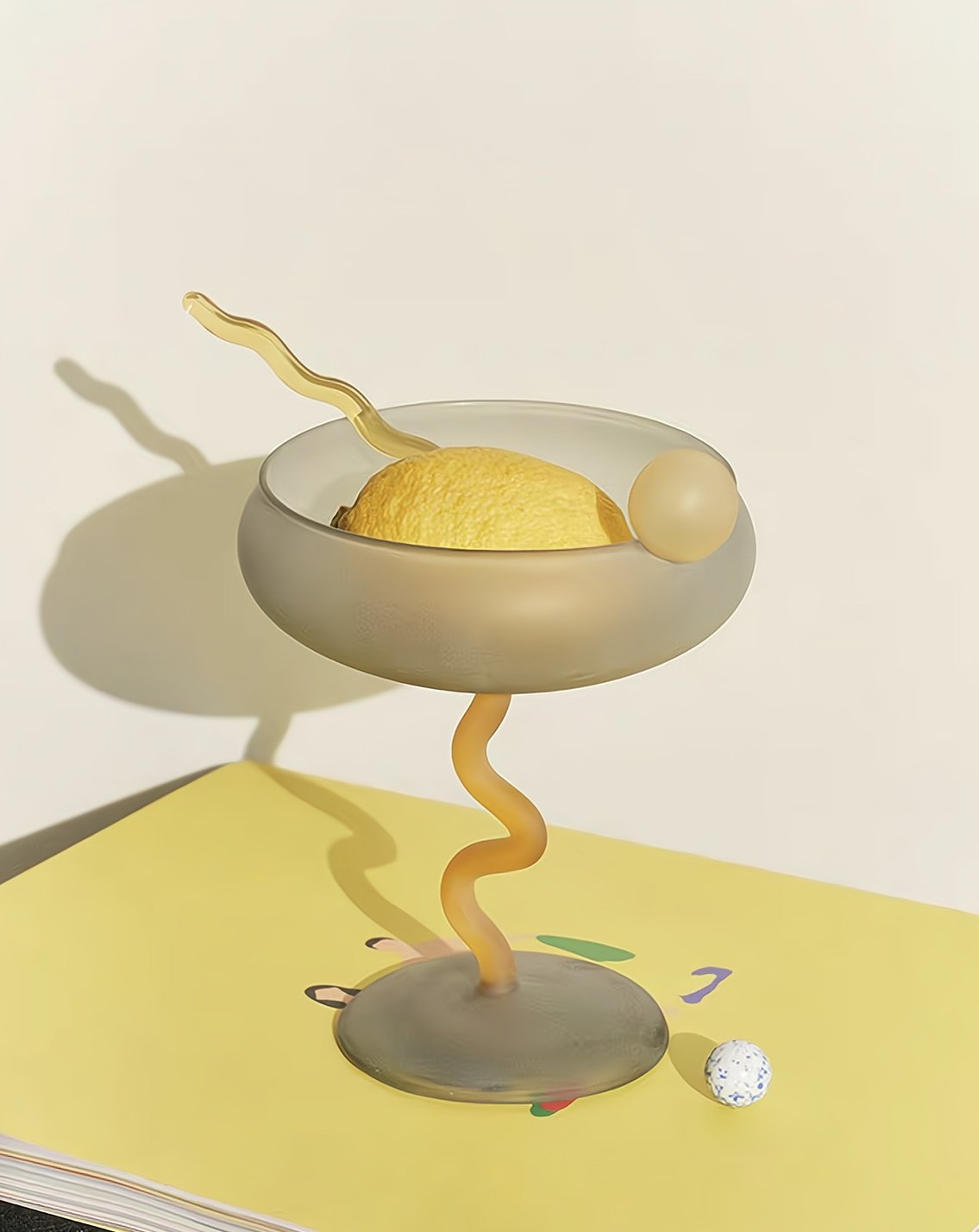 Decorative lamp with a spiral base on a light yellow surface